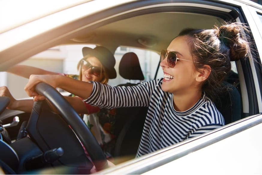 young people traveling in automobile