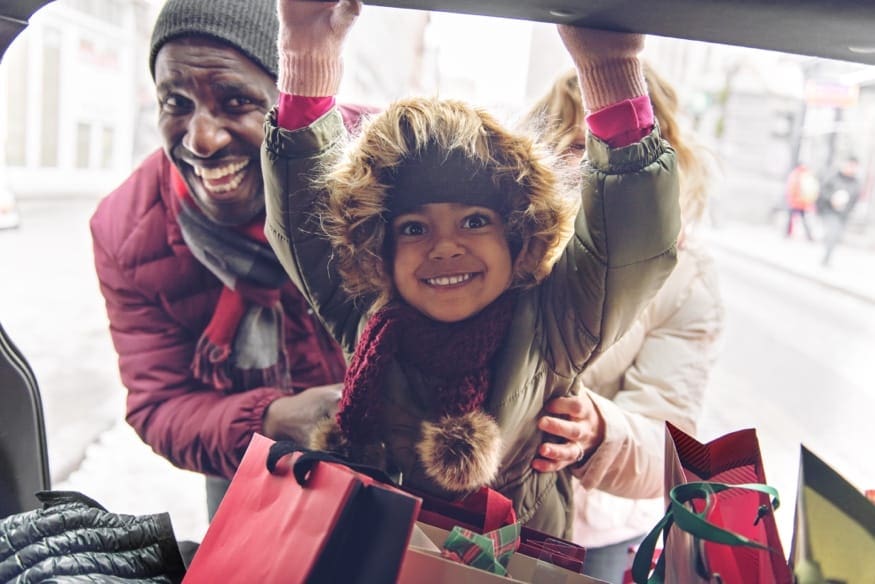 young family holiday shopping