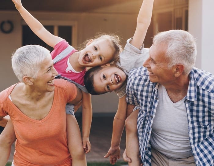 grandparents playing with grandchildren