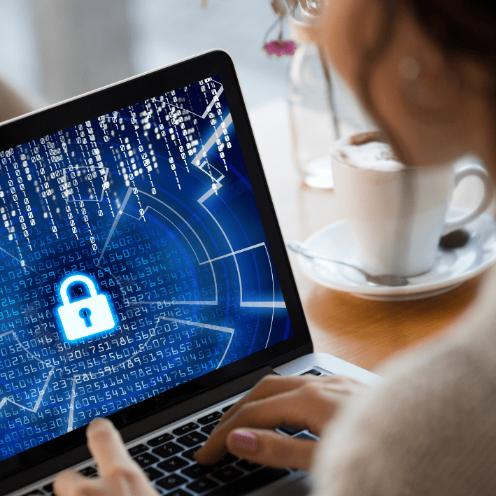 An image of a person using a laptop with a lock on screen for First Farmer's.