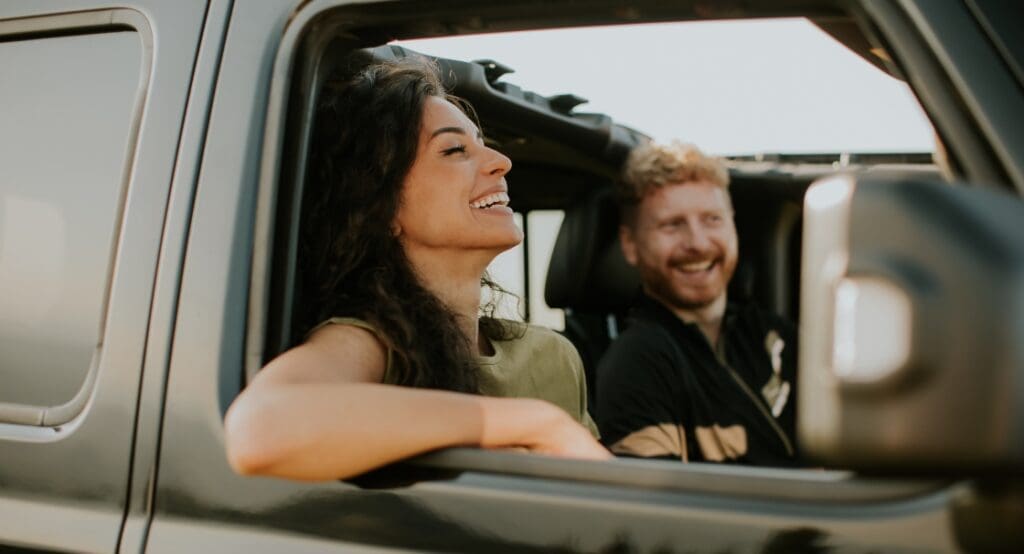 Couple happy driving car