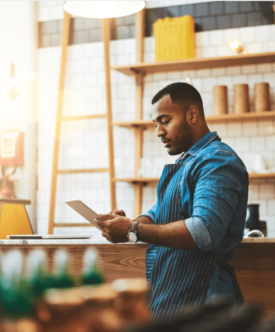 Barista looking at tablet